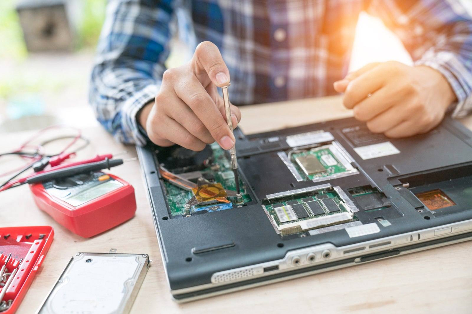 experienced technician working on computer repair large image