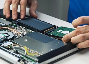 Experienced technician working to repair a computer